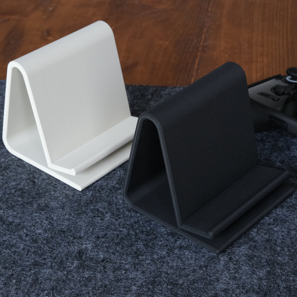 Handheld Display Stand in Deep Black and Ivory Beige.